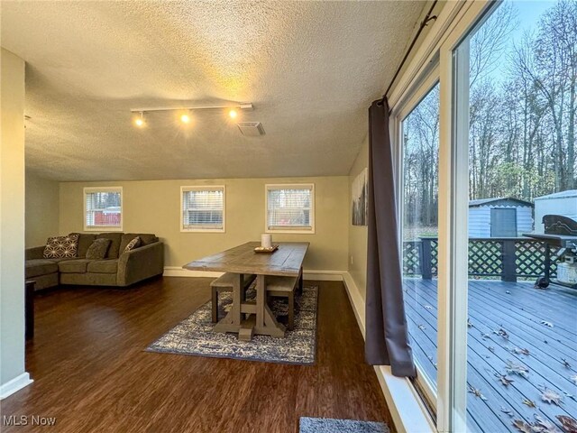 5192 University Dr, Geneva, OH 44041 - dining room with a textured ceiling, baseboards, and wood finished floors