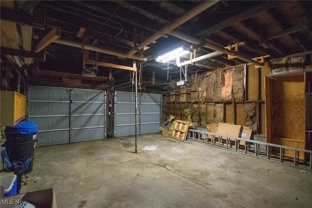 5192 University Dr, Geneva, OH 44041 - garage featuring a garage door opener