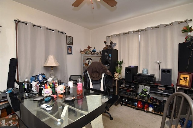 home office with carpet floors and a ceiling fan