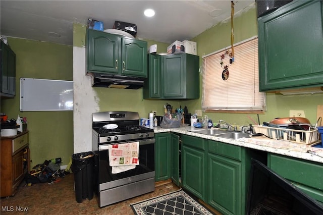 kitchen featuring green cabinetry, a sink, gas range, and under cabinet range hood