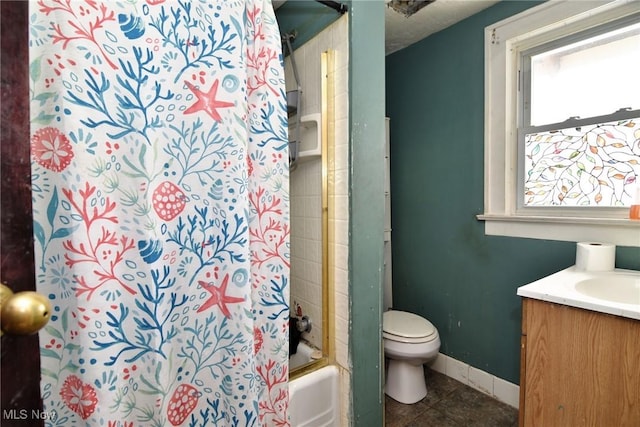 bathroom with toilet, vanity, baseboards, tile patterned floors, and shower / bath combination with curtain