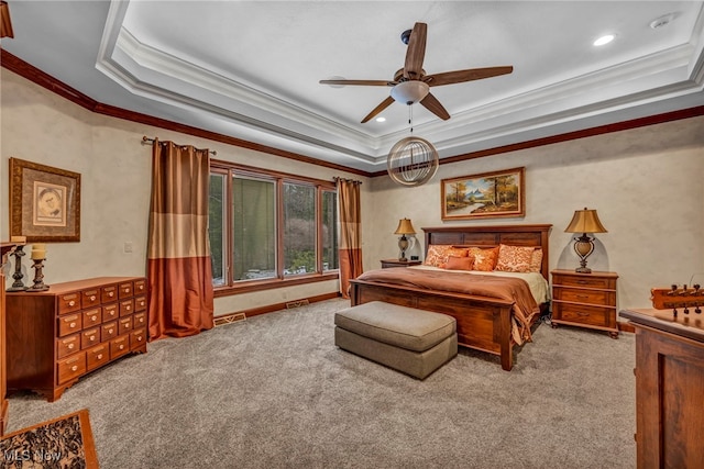 bedroom featuring a raised ceiling, carpet, and visible vents