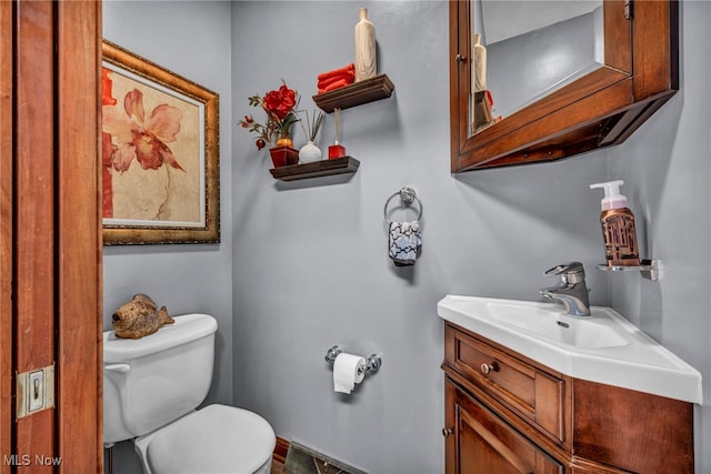 half bath with toilet and vanity