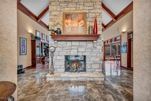 living room with a stone fireplace, a high ceiling, a healthy amount of sunlight, and marble finish floor