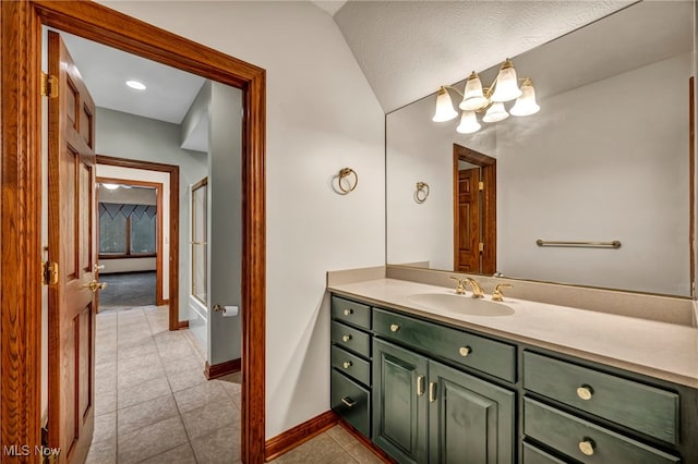 full bathroom with tile patterned floors, an enclosed shower, baseboards, and vanity