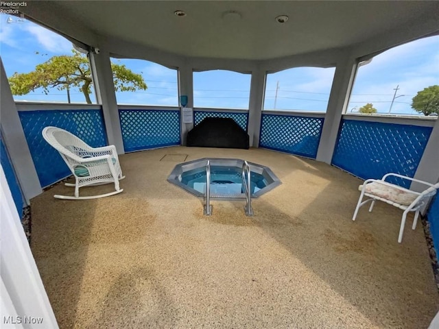 exterior space with an indoor in ground hot tub