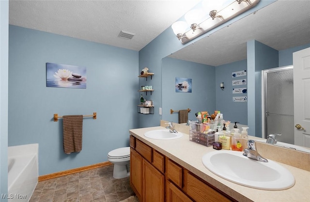 full bathroom with a shower stall, a textured ceiling, visible vents, and a sink