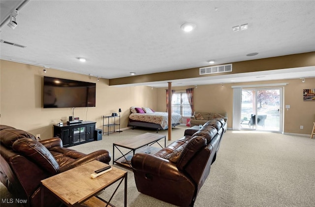 living room featuring carpet flooring, visible vents, and baseboards