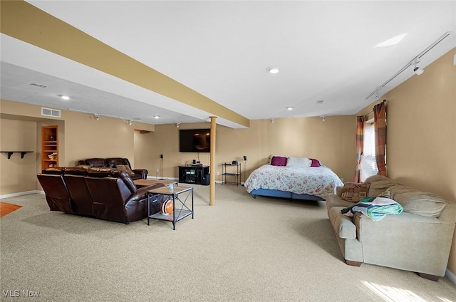 bedroom featuring recessed lighting, rail lighting, visible vents, light carpet, and baseboards