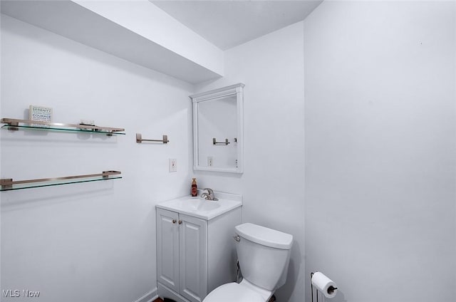 half bath with vanity and toilet