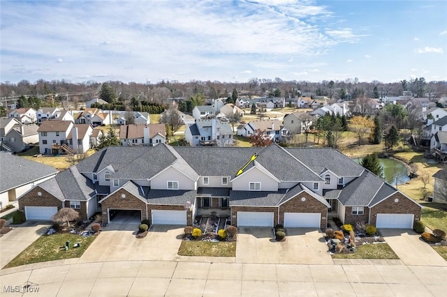 birds eye view of property with a residential view