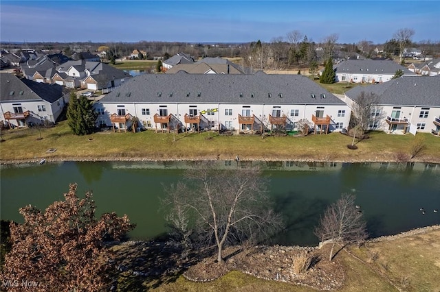 drone / aerial view with a residential view and a water view