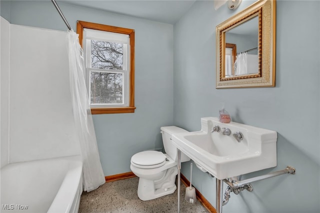 full bath with toilet, baseboards, and speckled floor