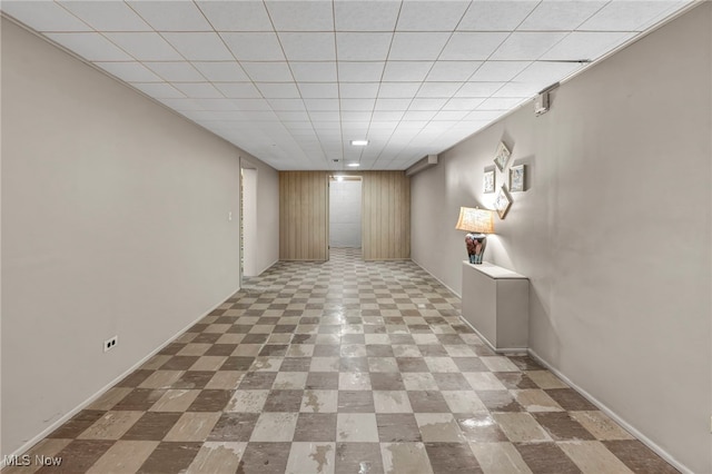 interior space featuring baseboards and tile patterned floors