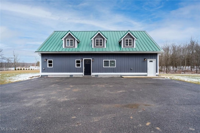 view of front of house with a standing seam roof and metal roof