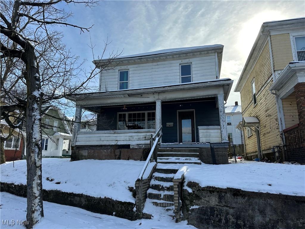 view of front of property featuring covered porch