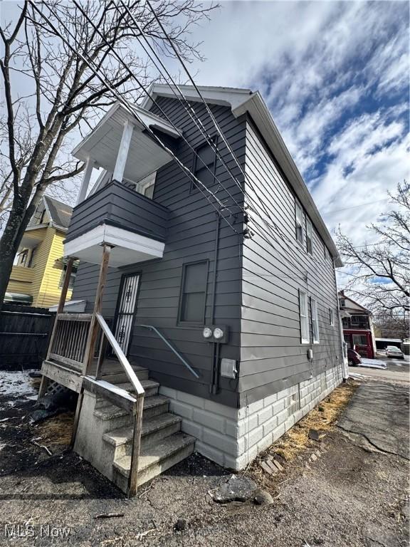 exterior space featuring a porch and a balcony