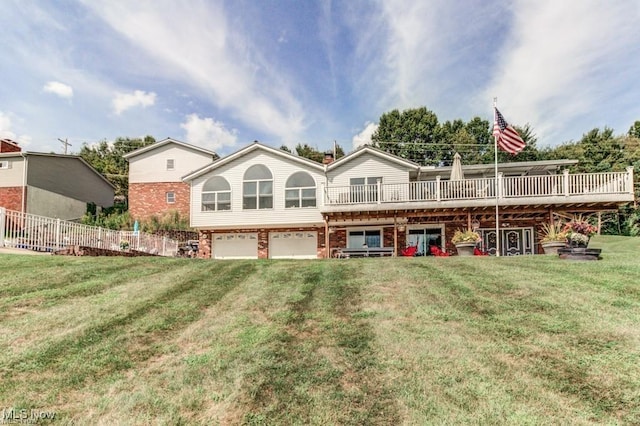 rear view of property with an attached garage, brick siding, and a yard