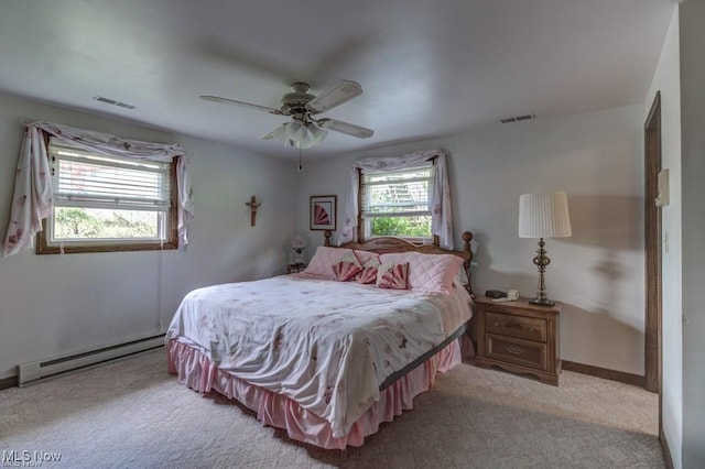 382 E Mohawk Dr, Malvern, OH 44644 - bedroom with a baseboard radiator, light colored carpet, ceiling fan, and baseboards