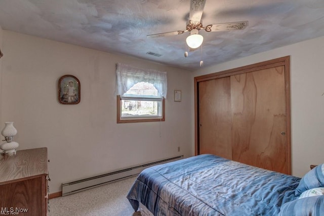 382 E Mohawk Dr, Malvern, OH 44644 - carpeted bedroom with baseboard heating, baseboards, a closet, and ceiling fan
