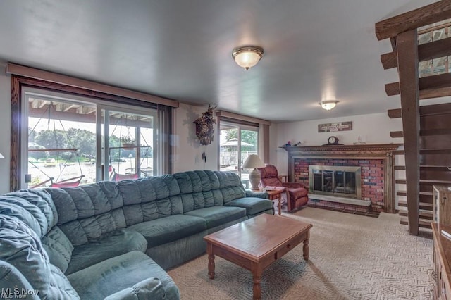 382 E Mohawk Dr, Malvern, OH 44644 - living area with a brick fireplace and light colored carpet
