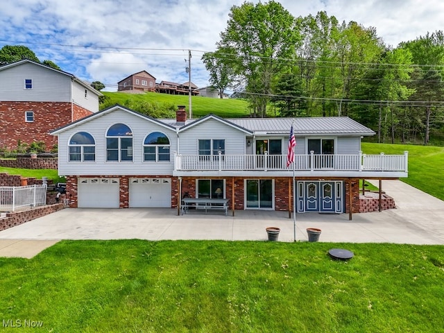 382 E Mohawk Dr, Malvern, OH 44644 - view of front facade with a garage, a front yard, brick siding, and driveway