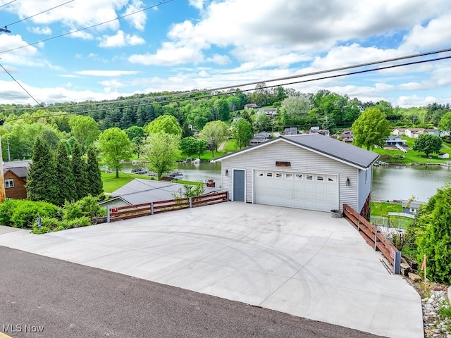 382 E Mohawk Dr, Malvern, OH 44644 - detached garage featuring a water view, fence, and view of scattered trees