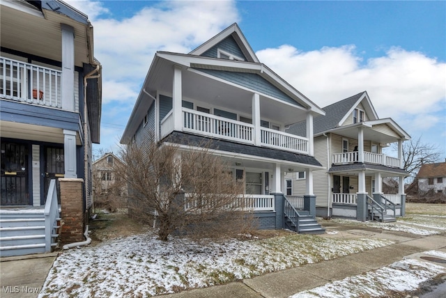 view of front of house featuring a balcony and a porch