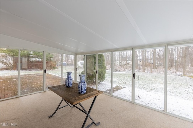 unfurnished sunroom with vaulted ceiling