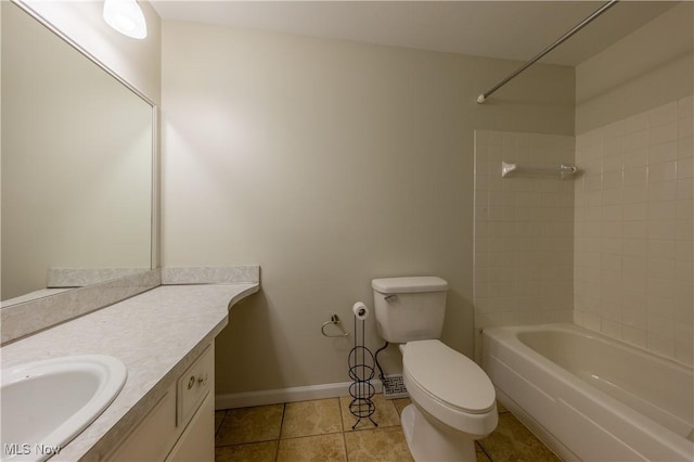 full bath featuring bathtub / shower combination, toilet, vanity, baseboards, and tile patterned floors