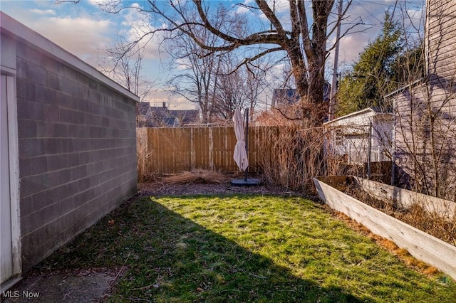 view of yard with a fenced backyard