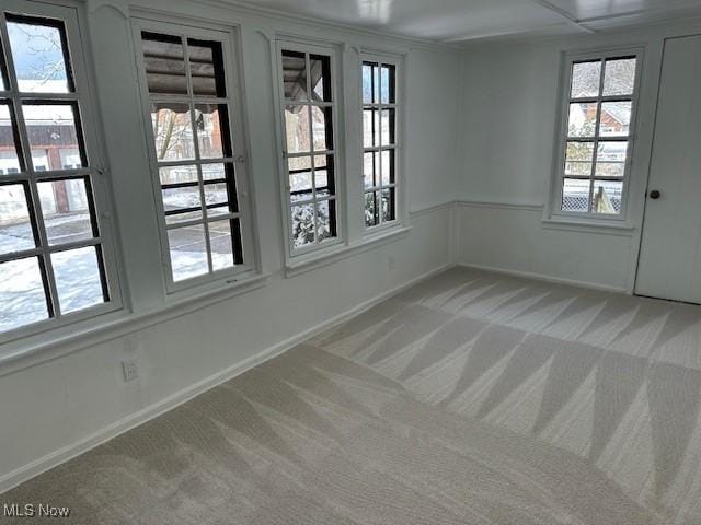 unfurnished room featuring carpet flooring