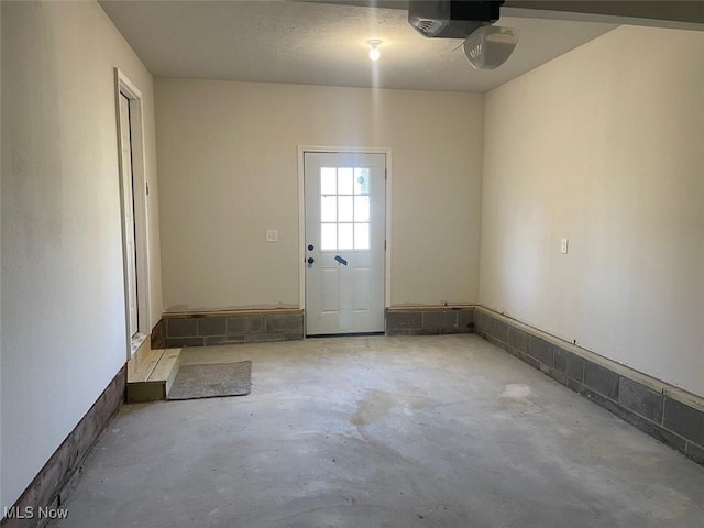 interior space with a garage door opener