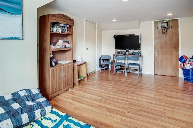 interior space featuring light wood-type flooring and recessed lighting