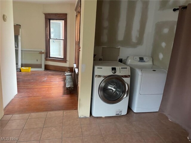 213 Montgomery, Marietta, OH 45750 - washroom with washing machine and clothes dryer and light tile patterned floors