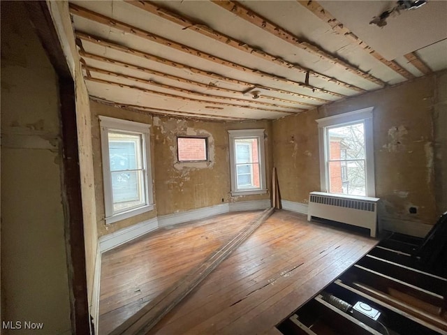 213 Montgomery, Marietta, OH 45750 - unfurnished room with radiator heating unit and light wood-style floors