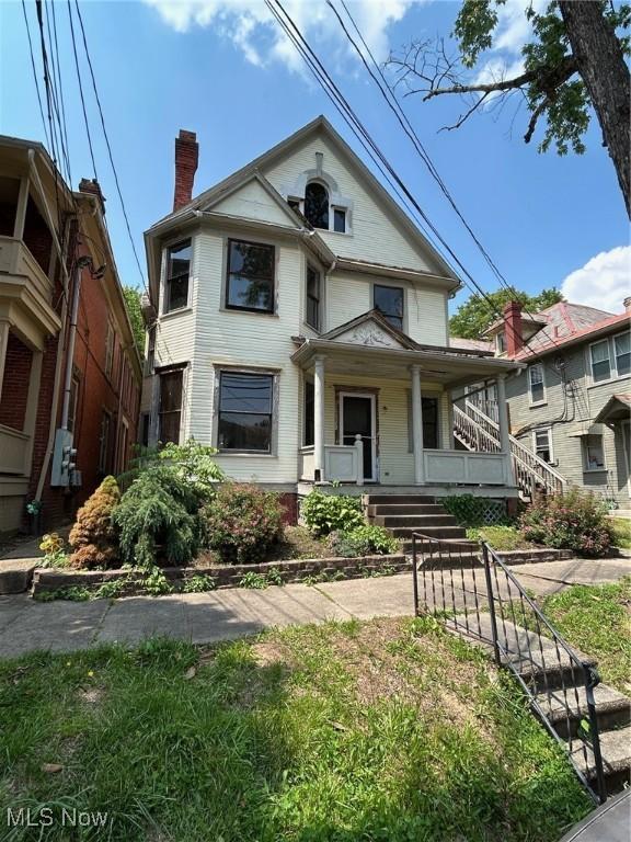 213 Montgomery, Marietta, OH 45750 - victorian house with a porch and a chimney