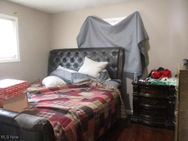 bedroom featuring wood finished floors