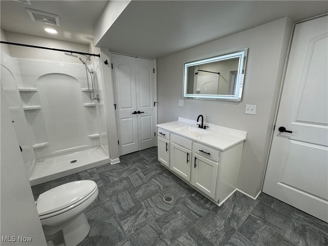 full bathroom featuring toilet, a shower, vanity, and visible vents