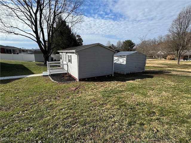 view of shed with fence