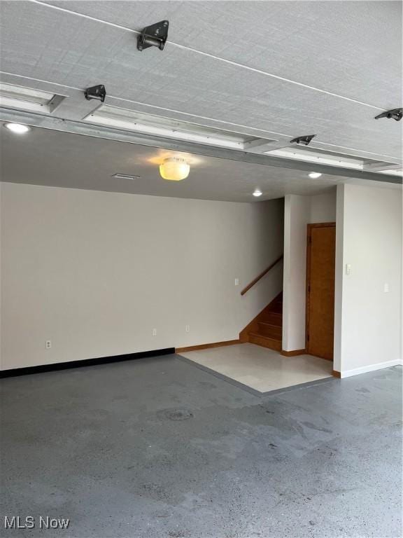 garage featuring baseboards