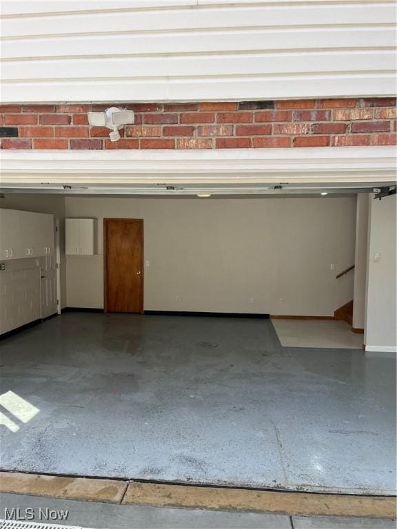 garage featuring baseboards