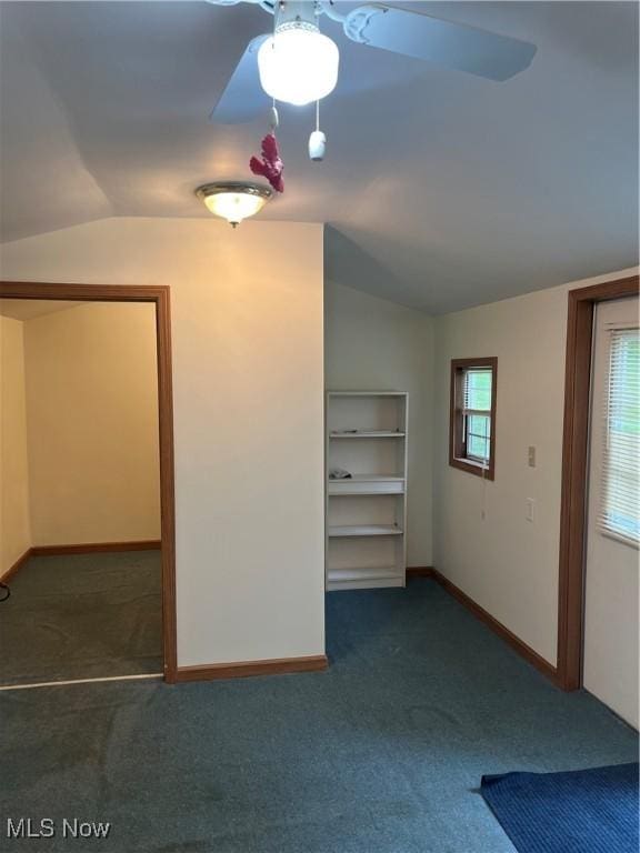 943 Pine St, Belpre, OH 45714 - carpeted empty room featuring lofted ceiling, ceiling fan, and baseboards