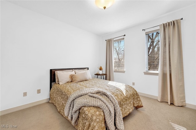 carpeted bedroom with baseboards