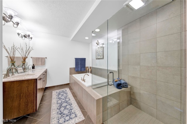 full bath featuring tile patterned floors, a garden tub, a sink, a shower stall, and double vanity