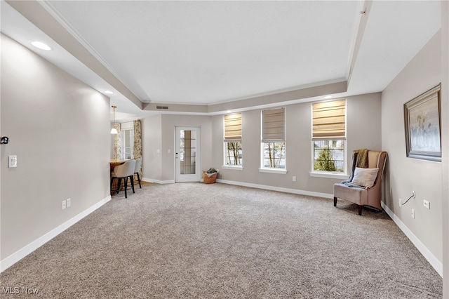 unfurnished room featuring visible vents, baseboards, a tray ceiling, carpet floors, and recessed lighting