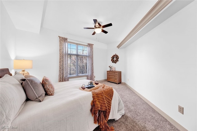 bedroom with light colored carpet, baseboards, and ceiling fan