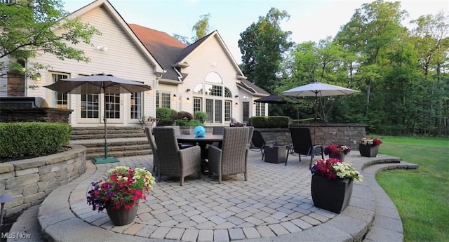 view of patio / terrace featuring entry steps and outdoor dining space