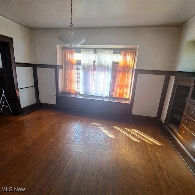 unfurnished room featuring hardwood / wood-style flooring