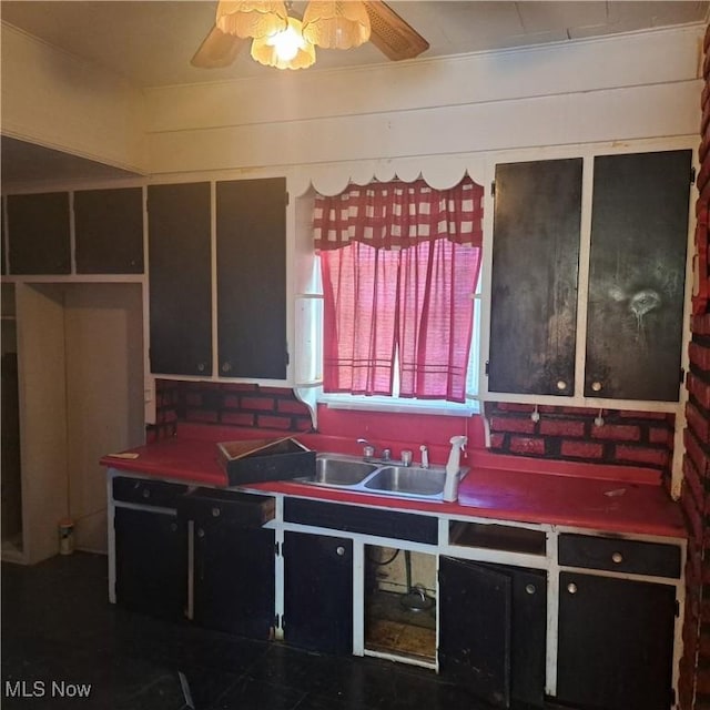 kitchen with a sink and a ceiling fan